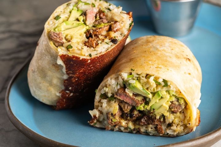 Puesto Anaheim signature dishes Filet Mignon BurritoChips and SalsaChicken al Pastor BurritoFilet Mignon Taco